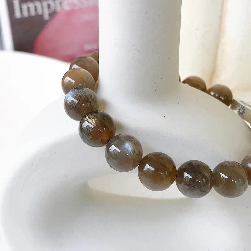 Moonstone Crystal Bracelet with Sun & Moon Charms – Mystical Black Sunstone Energy Jewelry